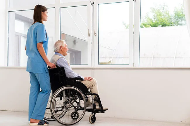 nurse with man in wheelchair - power of attorney